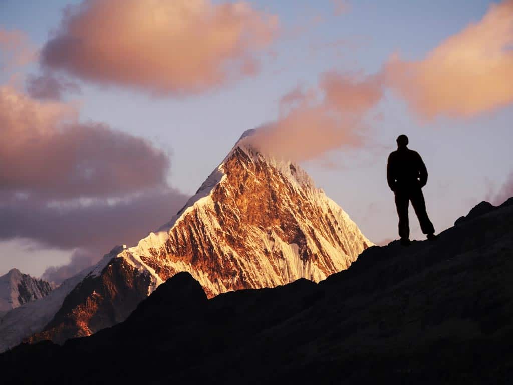 A lone traveler taking in the view over Machu Picchu